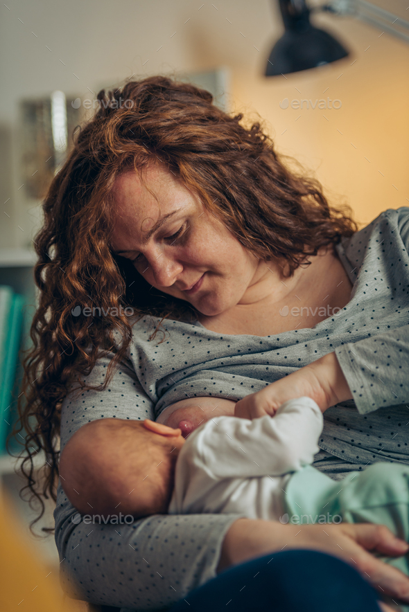 Breastfeeding releases bonding hormones Stock Photo by zamrznutitonovi